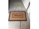 Welcoming entryway with a 'Welcome' mat and tile flooring at 12123 W Bell Rd # 118, Surprise, AZ 85378