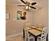 Cozy dining area with a modern ceiling fan and neutral color scheme at 12123 W Bell Rd # 218, Surprise, AZ 85378