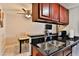 Efficient kitchen showcasing granite countertops and stainless steel appliances at 12123 W Bell Rd # 218, Surprise, AZ 85378