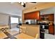 Open-concept living space with bar seating and stainless steel appliances at 12123 W Bell Rd # 218, Surprise, AZ 85378