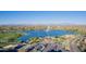 Beautiful aerial shot of the lake, water fountain, playground, and surrounding community at 12625 N Saguaro Blvd # 203, Fountain Hills, AZ 85268