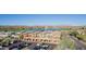 Scenic aerial view showcases the commercial buildings near a lake with fountain and mountain views in background at 12625 N Saguaro Blvd # 203, Fountain Hills, AZ 85268