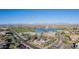 Expansive aerial view featuring commercial buildings, a lake with fountain, golf course, roads and mountains at 12625 N Saguaro Blvd # 203, Fountain Hills, AZ 85268