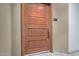 Modern door for apartment 203 with a dark metal handle and frame at 12625 N Saguaro Blvd # 203, Fountain Hills, AZ 85268