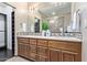 Bathroom with and sinks, wooden cabinetry and granite countertops at 12625 N Saguaro Blvd # 203, Fountain Hills, AZ 85268