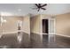 Open bedroom boasts dark floors, neutral paint, a fan, and walk-in closet at 12625 N Saguaro Blvd # 203, Fountain Hills, AZ 85268
