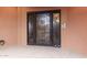 Elegant front door with a decorative security gate and adjacent call box at 12625 N Saguaro Blvd # 203, Fountain Hills, AZ 85268