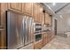 Modern kitchen featuring stainless steel appliances, wood cabinetry, and granite countertops at 12625 N Saguaro Blvd # 203, Fountain Hills, AZ 85268