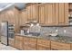 Bright kitchen features granite counters, stainless appliances and breakfast bar at 12625 N Saguaro Blvd # 203, Fountain Hills, AZ 85268