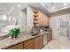 Kitchen with granite countertops, wood cabinets, and an open layout to the living space at 12625 N Saguaro Blvd # 203, Fountain Hills, AZ 85268