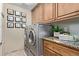Convenient laundry room with granite counters and extra storage at 12625 N Saguaro Blvd # 203, Fountain Hills, AZ 85268