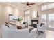 Living room features a cozy fireplace, plush seating, and ample natural light at 12625 N Saguaro Blvd # 203, Fountain Hills, AZ 85268