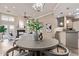 Open-concept living space with fireplace, bright natural light, and view of kitchen at 12625 N Saguaro Blvd # 203, Fountain Hills, AZ 85268