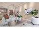 Living room features neutral decor, a cozy seating area, and access to dining and kitchen spaces at 12625 N Saguaro Blvd # 203, Fountain Hills, AZ 85268