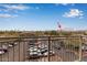 Balcony view featuring parking area, neighborhood businesses, and McDowell mountains at 12625 N Saguaro Blvd # 203, Fountain Hills, AZ 85268