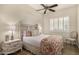 Bedroom featuring a decorative headboard, ceiling fan, and shutters on the windows at 13207 W Santa Ynez Dr, Sun City West, AZ 85375