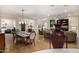 Open concept dining area flowing into living space, offering inviting atmosphere at 13207 W Santa Ynez Dr, Sun City West, AZ 85375