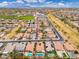 Overhead view of a neighborhood close to community resources like a school and sporting fields at 14906 W Luna N Dr, Litchfield Park, AZ 85340