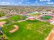 View of baseball and sports fields, featuring green spaces, tracks, and access to parking at 14906 W Luna N Dr, Litchfield Park, AZ 85340