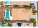 An aerial shot of a neighborhood with nearby pools, desert landscaping, and tile roofing at 14906 W Luna N Dr, Litchfield Park, AZ 85340