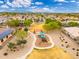 Aerial view of a neighborhood with a playground in a park and blue skies at 14906 W Luna N Dr, Litchfield Park, AZ 85340