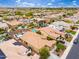 Aerial view of residential neighborhood with swimming pools and well-maintained landscaping at 14906 W Luna N Dr, Litchfield Park, AZ 85340