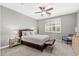 Bedroom with a neutral palette, carpeted floor, and ample natural light through shuttered windows at 14906 W Luna N Dr, Litchfield Park, AZ 85340