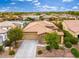 Beautiful single-story home with desert landscaping, tile roof, and a spacious driveway at 14906 W Luna N Dr, Litchfield Park, AZ 85340