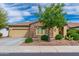 Charming single-Gathering home featuring desert landscaping and a mix of stone and stucco exterior at 14906 W Luna N Dr, Litchfield Park, AZ 85340