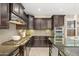Well-appointed kitchen with a cooktop, stainless steel appliances, ample cabinetry, and stylish backsplash at 14906 W Luna N Dr, Litchfield Park, AZ 85340