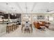 Open-concept living space featuring tile floors, modern lighting, and a seamless flow for entertaining and relaxation at 14906 W Luna N Dr, Litchfield Park, AZ 85340