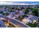 Inviting aerial view of a residential home featuring a well-maintained lawn and lush trees in a quiet neighborhood at 1528 E Harrison St, Gilbert, AZ 85295