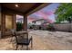 Outdoor back patio area, ideal for relaxation or gatherings, with ample space for seating and enjoying the twilight at 1528 E Harrison St, Gilbert, AZ 85295