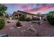 Expansive backyard with desert landscaping, custom water feature, and stone walkway, an outdoor sanctuary at 1528 E Harrison St, Gilbert, AZ 85295