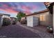 Charming backyard featuring low maintenance landscaping, a storage shed, and great exterior views at 1528 E Harrison St, Gilbert, AZ 85295