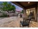 Backyard with a stone patio, built-in BBQ, and lovely landscaping, creating an inviting outdoor living space at 1528 E Harrison St, Gilbert, AZ 85295