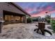Backyard with stone patio, water feature, and landscaping, providing a private outdoor retreat at 1528 E Harrison St, Gilbert, AZ 85295