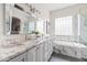 Spacious bathroom featuring dual sinks, granite countertops, and a luxurious marble shower at 1528 E Harrison St, Gilbert, AZ 85295