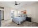 Well-lit bedroom with a ceiling fan and ensuite bath access for added privacy at 1528 E Harrison St, Gilbert, AZ 85295