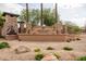 Elegant Ashland Ranch community entrance sign surrounded by lush landscaping and stone accents for a welcoming arrival at 1528 E Harrison St, Gilbert, AZ 85295