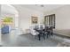 Elegant dining room with modern table and chairs, adjacent to a spacious living area at 1528 E Harrison St, Gilbert, AZ 85295