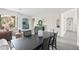Open-concept dining room featuring a dark wood table and views into the living room and office at 1528 E Harrison St, Gilbert, AZ 85295