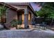 Charming covered front porch with seating, complemented by lush landscaping and architectural details at 1528 E Harrison St, Gilbert, AZ 85295