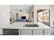 Kitchen island with sink overlooks the living area and backyard views at 1528 E Harrison St, Gilbert, AZ 85295