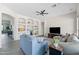 Open-concept living room featuring built-in shelves and a cozy sectional sofa for relaxing at 1528 E Harrison St, Gilbert, AZ 85295