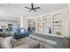 Bright living room featuring built-in shelves and a cozy sectional sofa for relaxing at 1528 E Harrison St, Gilbert, AZ 85295