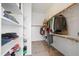 Organized walk-in closet featuring shelving and rods, providing ample storage space at 1528 E Harrison St, Gilbert, AZ 85295
