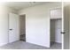 Spare bedroom with neutral paint, plush carpet and a closet for storage at 16010 S Elizabeth Pl, Arizona City, AZ 85123