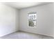 Neutral bedroom with plush carpeting, a window offering natural light and neutral paint at 16010 S Elizabeth Pl, Arizona City, AZ 85123