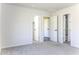 Open bedroom showcases multiple doorways offering access to closet and bathroom at 16010 S Elizabeth Pl, Arizona City, AZ 85123